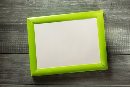 photo picture frame at wooden background