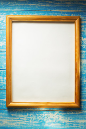 photo picture frame on wooden backgroundの写真素材