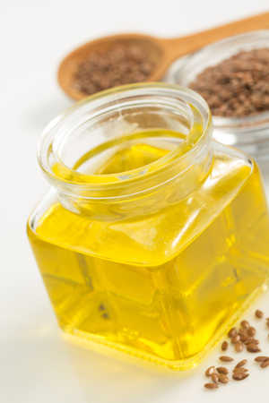 linseed oil in bottle isolated on white backgroundの写真素材