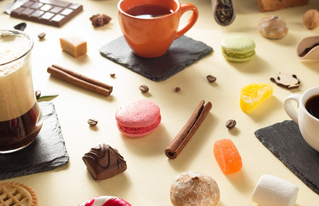 coffee cup and beans at paper backgroundの写真素材