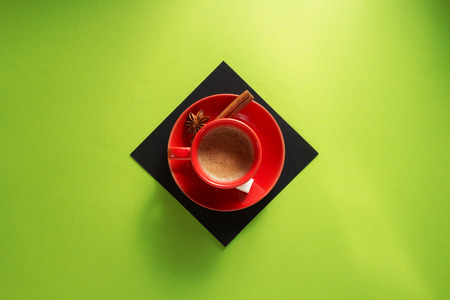 cup of coffee at colorful paper backgroundの写真素材