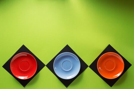 empty saucer at abstract colorful backgroundの写真素材