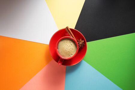 cup of coffee at colorful paper backgroundの写真素材