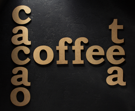 coffee, cacao and tea letters on black backgroundの写真素材