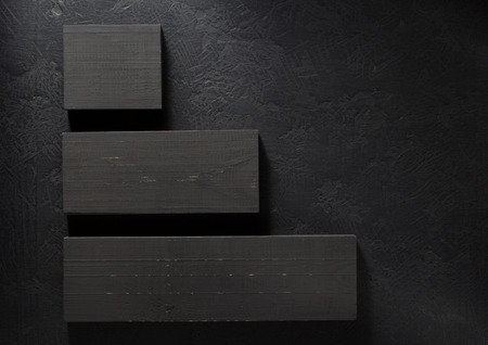 wooden board at black background  textureの写真素材