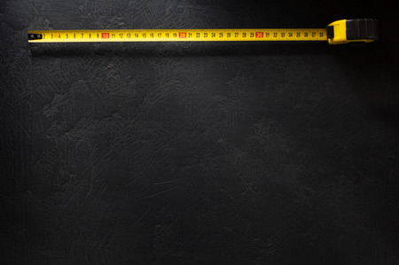 tape measure  on black backgraund