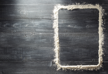flour powder on wooden backgroundの写真素材