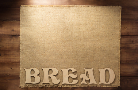 burlap hessian sacking on wooden backgroundの写真素材