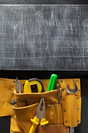 tools and instruments in belt on black backgroundの写真素材