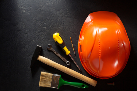 hardhat and tools  on black backgroundの写真素材