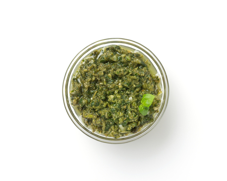pesto sauce in bowl isolated on white backgroundの写真素材