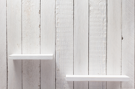 white shelf on wooden wall background textureの写真素材