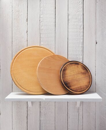 pizza cutting board at shelf on  wooden backgroundの写真素材