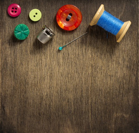 sewing tools and accessories on wooden table backgroundの写真素材