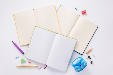 school accessories and notebook or book with empty pages on white  background, top viewの写真素材
