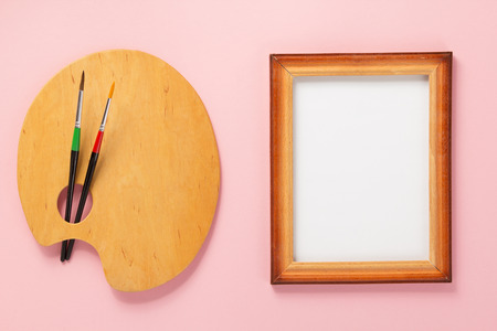 palette and picture frame on abstract background
