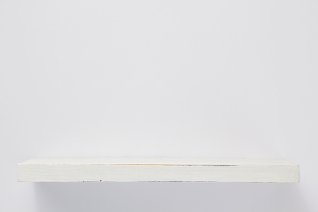 wooden shelf at white background texture wallの写真素材