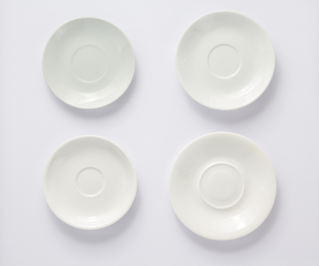 empty plate and saucer on white  background, top viewの写真素材