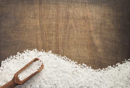 sea salt spice on wooden table background, top viewの写真素材