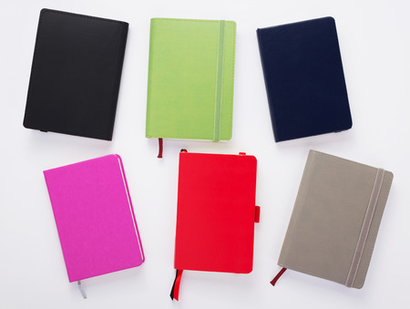 paper notebook at white background, top view