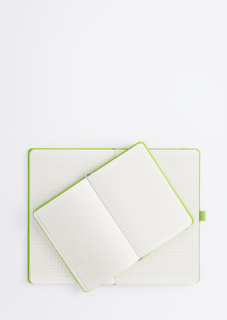 Notebook at white paperの写真素材