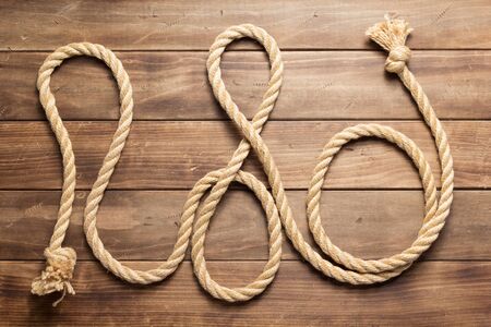 ship rope at wooden background texture, top veiw