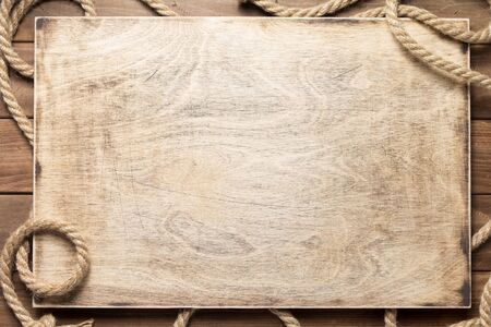 ship rope at wooden board background texture, top veiw