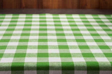cloth napkin at rustic table in front, wooden plank board backgroundの写真素材