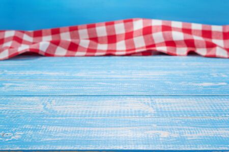 Cloth napkin at rustic table in front, wooden plank boardの写真素材