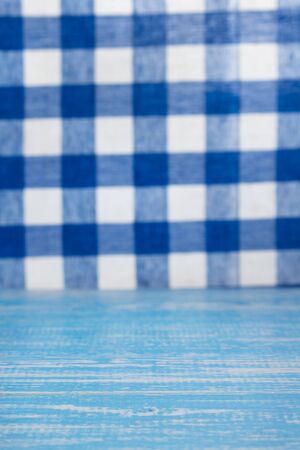 Rustic wooden table in front and cloth napkin, plank boardの写真素材