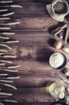 Bakery ingredients on wooden plankの写真素材