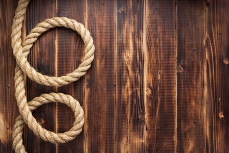 ship rope at wooden background, plank board textureの写真素材