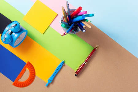 school accessories and office supplies at abstract paper background surfaceの写真素材