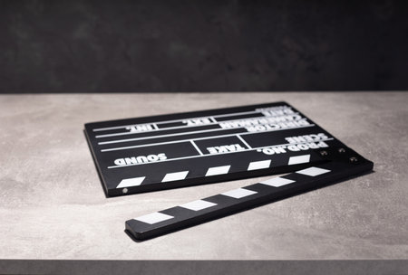 movie clapper board or clapperboard at table background textureの写真素材