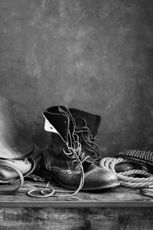 pantbrush or brushes at painted background texture and paints set on abstract table surface, art painter conceptの写真素材