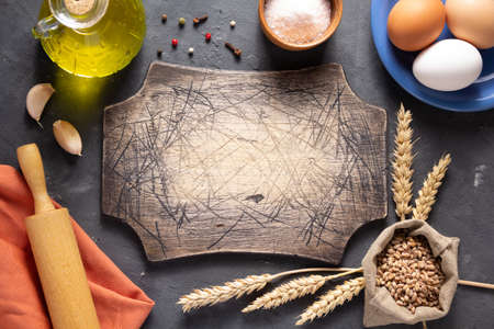 Bakery ingredients for homemade bread baking on table. Food recipe top view at stone background...