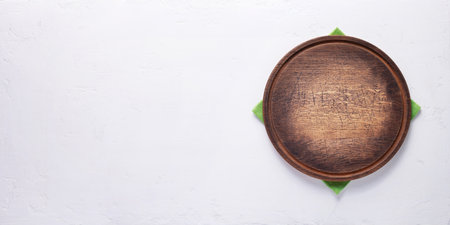 Pizza or bread cutting board for homemade baking on table. Food recipe concept at stone background texture with copy space. Flat lay of panorama, panoramic top viewの写真素材