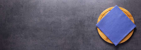 Pizza cutting board and cloth napkin on stone surface of table. Food recipe concept at tabletop or wall background texture with copy space. Flat lay of  panorama, panoramic top viewの写真素材