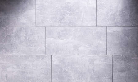 Stone or marble surface background of tile floor or wall texture.  Grey laminate background with copy spaceの写真素材
