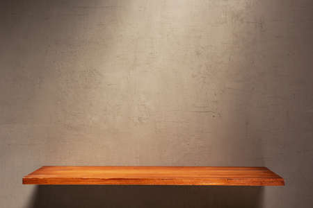 Wooden shelf at wall background texture as abstract surface. Book shelf at at old wall textureの写真素材