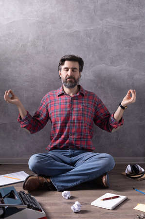 Man meditating on floor thinking idea or relaxing.の写真素材