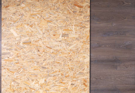 Chipboard texture. Wooden osb surface at wood laminate floor with copy spaceの写真素材