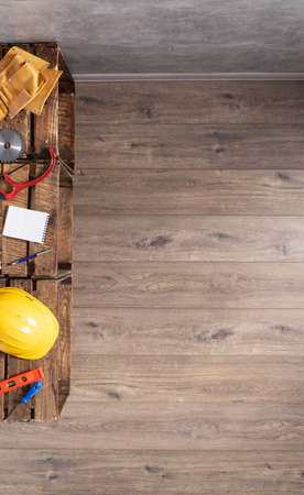 Set of tools and construction instruments on wooden floor background. Work repair renovation concept top viewの写真素材