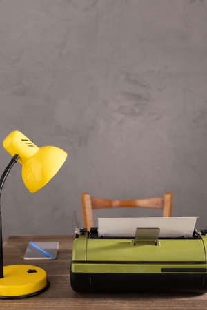 Vintage old typewriter at wooden desk table. Writer or screenwriter creative  conceptの写真素材