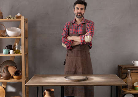 Baker man making dough and bakery ingredients for homemade bread cooking on table. Bakery concept and male handの写真素材