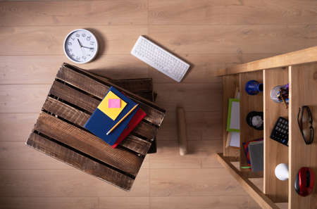 Stack of wooden box and furniture on floor laminate background. Wood shelving and boxes crate top viewの写真素材