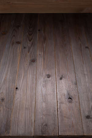 Wooden table top background texture.  Wood tabletop front view with copy space. Plank board surfaceの写真素材