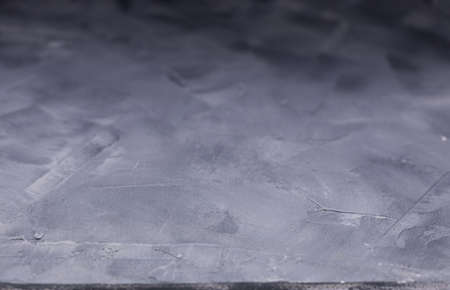 Abstract painted  background texture as table top. Plaster surface front view with copy space