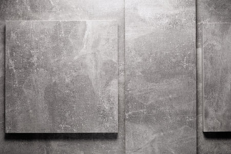 Abstract grey background texture at table or wall surface. Gray piece of chipboard at table...