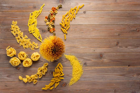 Pasta collection food on wooden table background. Raw pasta italian food at tabletopの写真素材